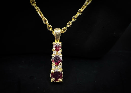 Gold Toned Red Garnet Pendant Necklace with Small Clear Stones