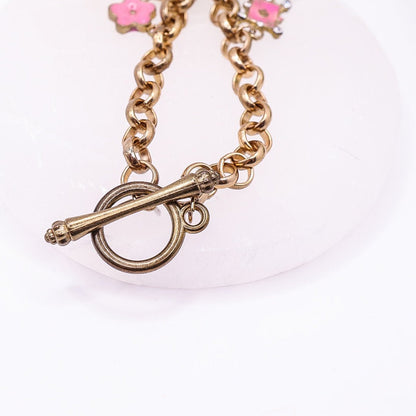 Golden Belcher Chain Toggle Clasp Bracelet with Eiffel Tower, Ace, Stars Charms