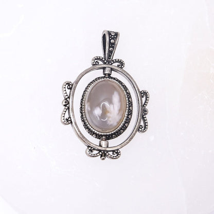 Sakura Agate Rotating Pendant | Intuitively Chosen